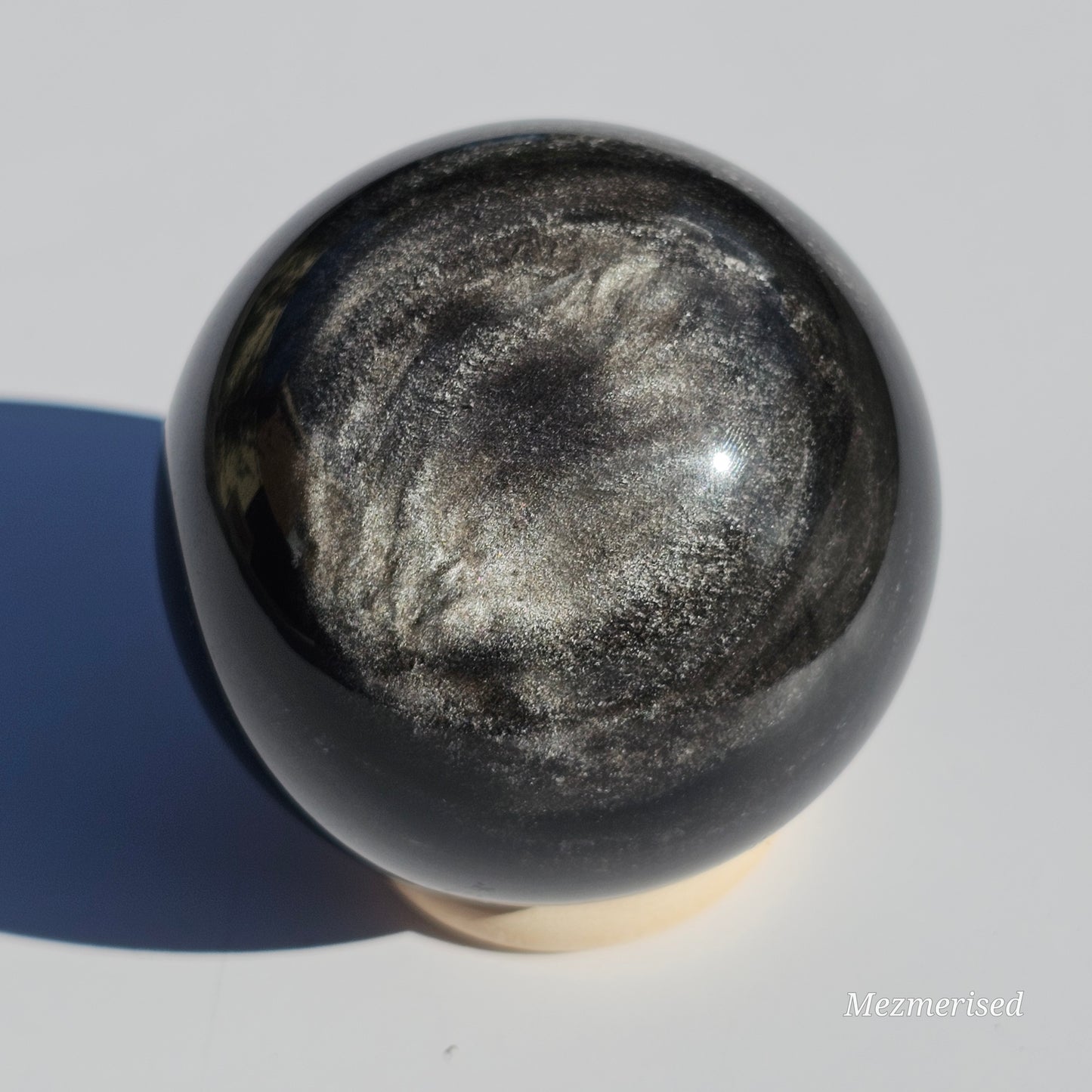 Black Obsidian sphere with an alluring sheen of Silver.