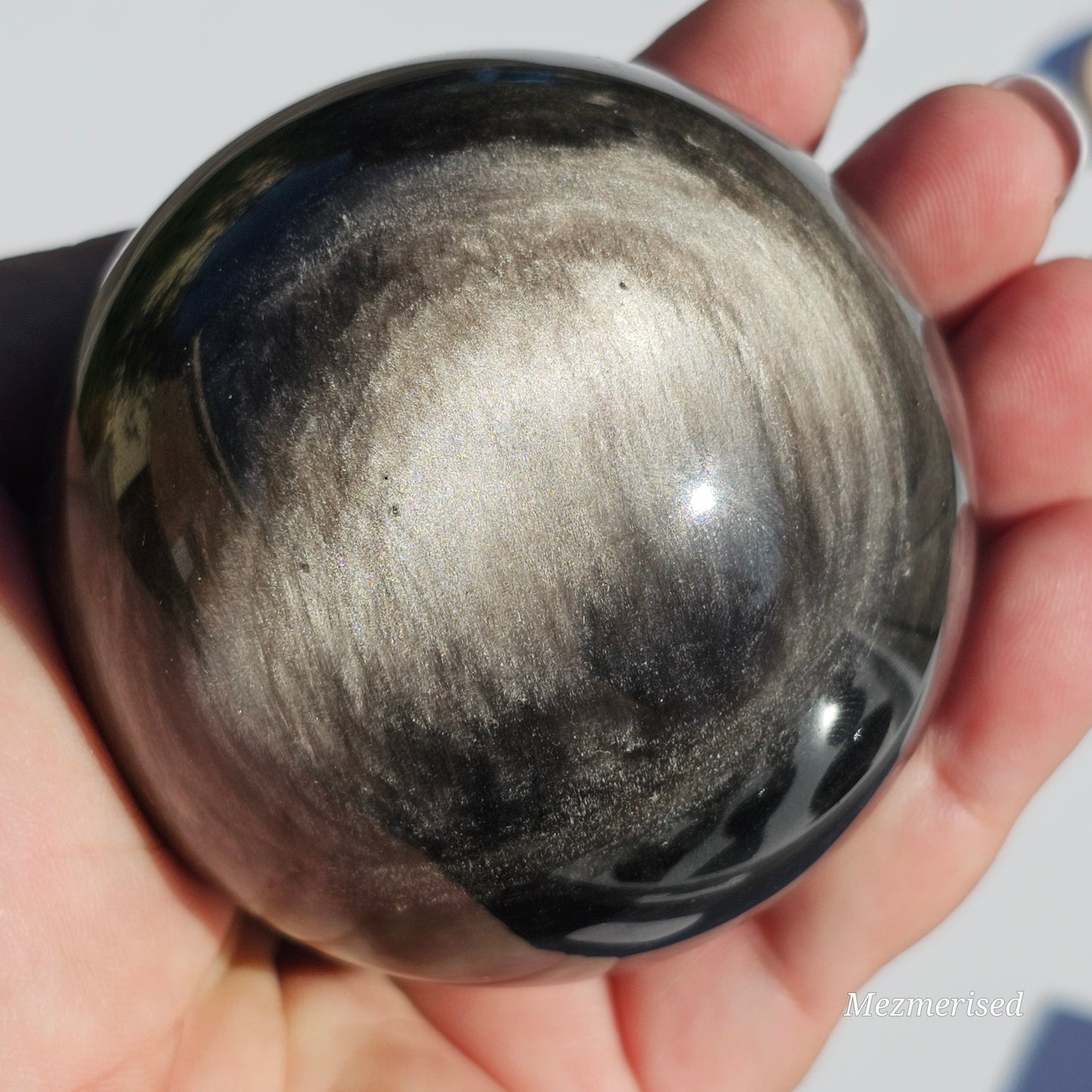 Black Obsidian sphere with an alluring sheen of Silver.