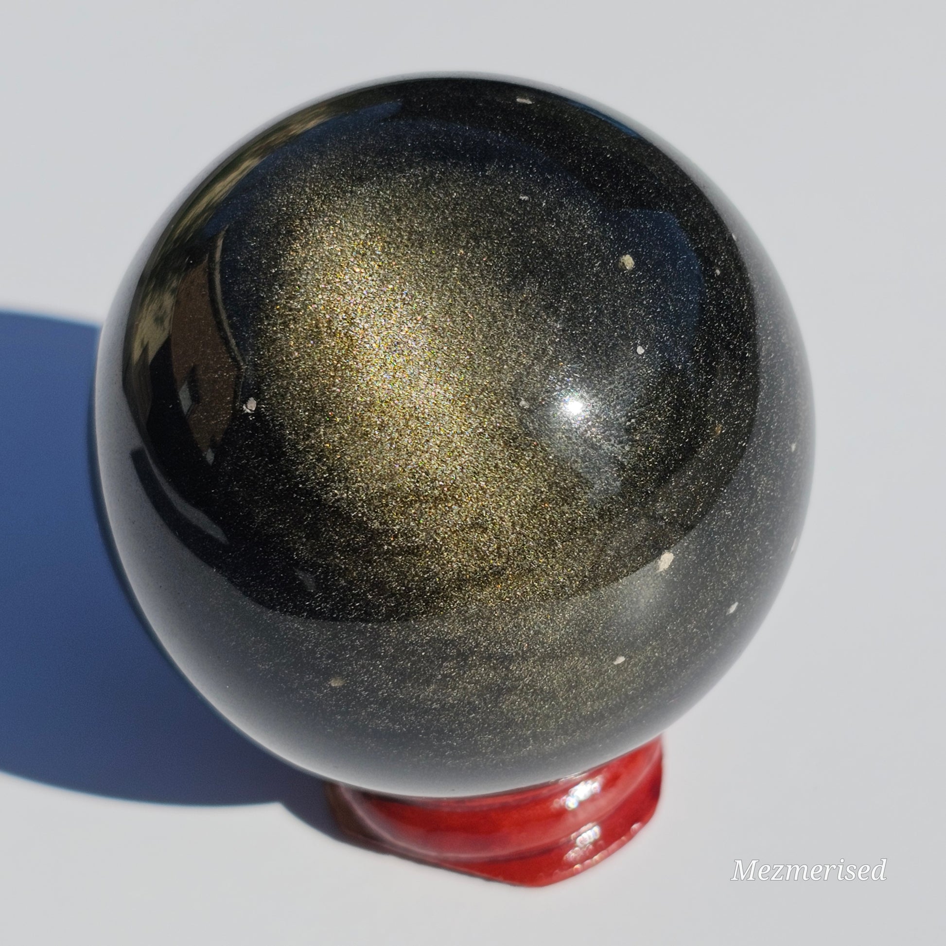 Black Obsidian sphere with an alluring sheen of Gold.