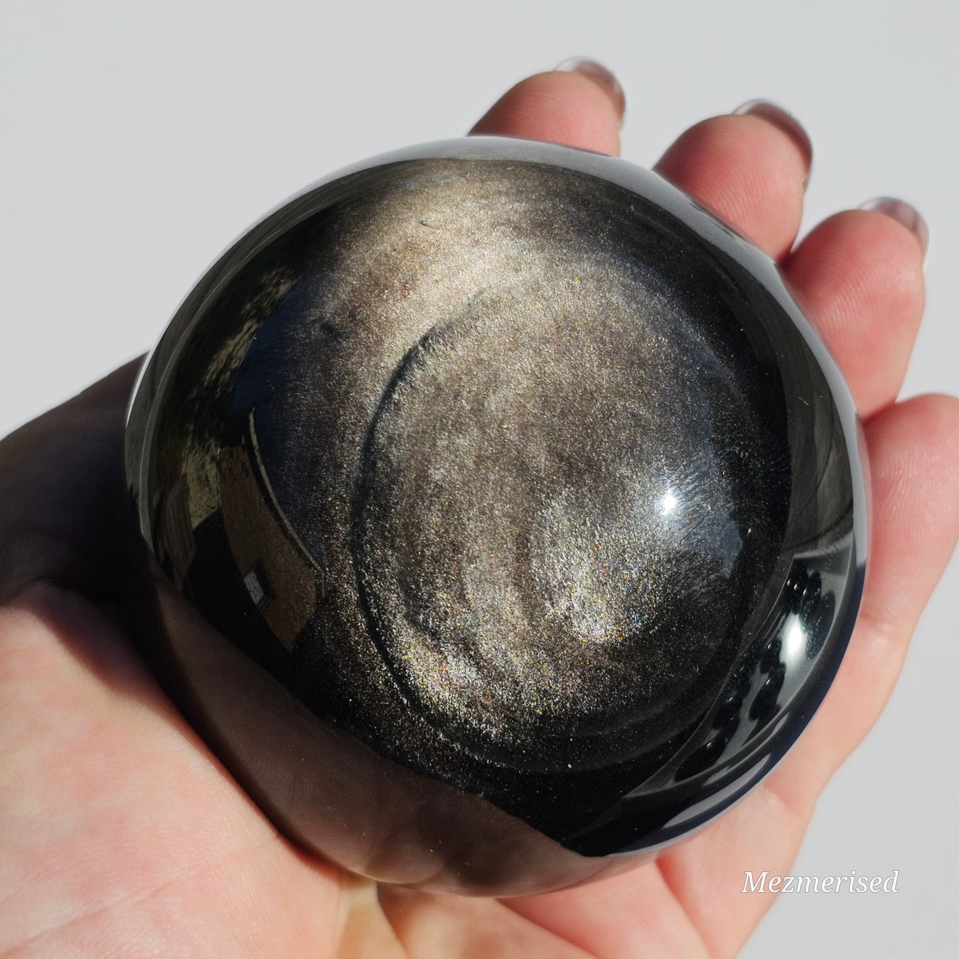 Black Obsidian sphere with an alluring sheen of Silver.