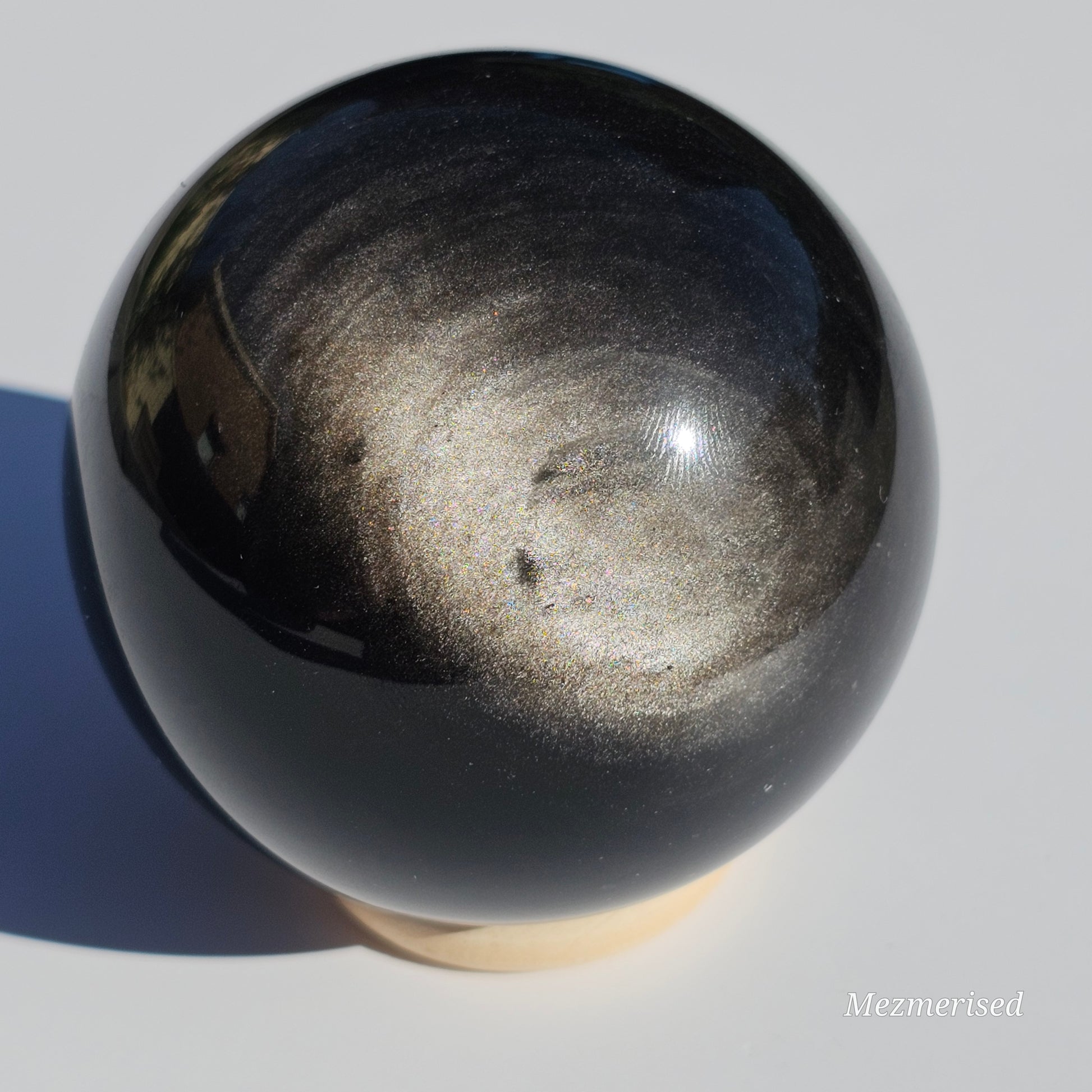 Black Obsidian sphere with an alluring sheen of Silver.