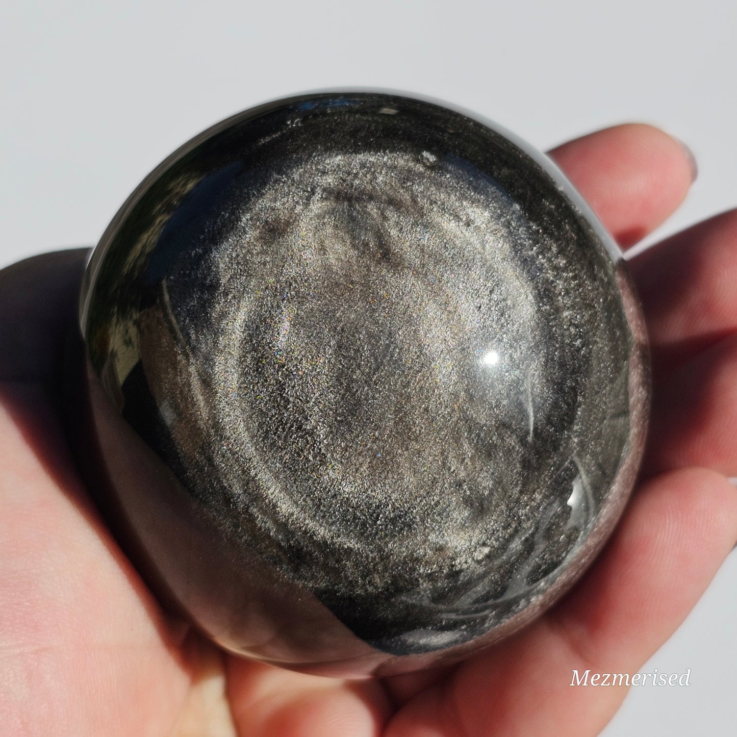 Black Obsidian sphere with an alluring sheen of Silver.