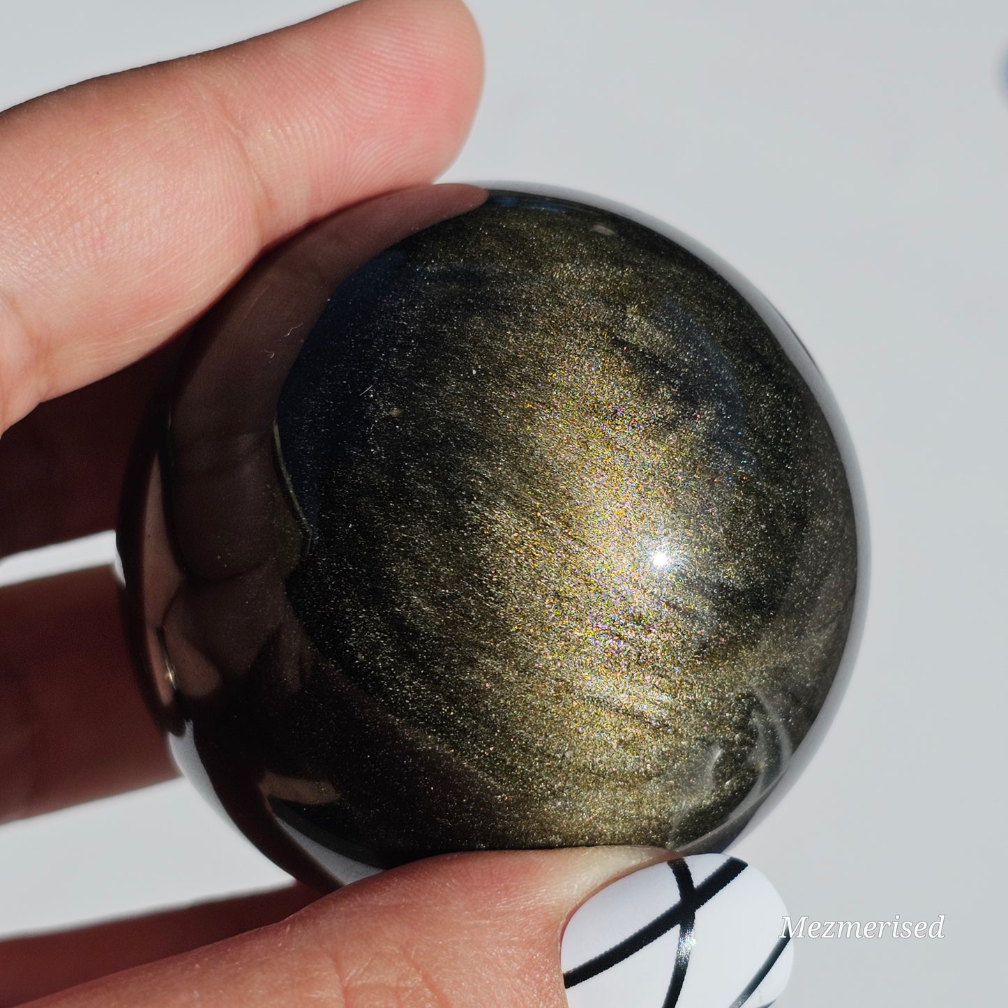 Black Obsidian sphere with an alluring sheen of Gold.