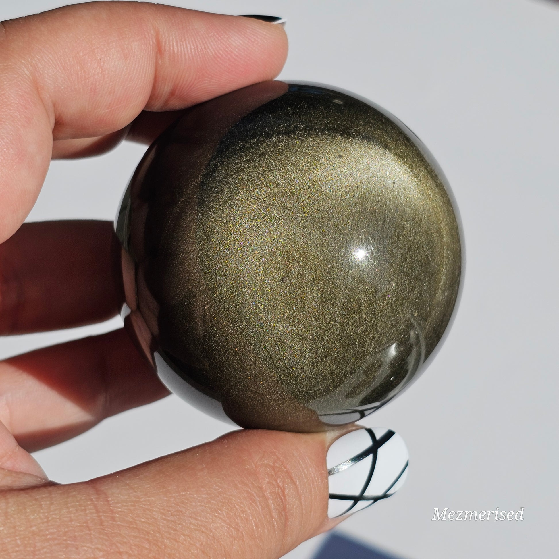 Black Obsidian sphere with an alluring sheen of Gold.