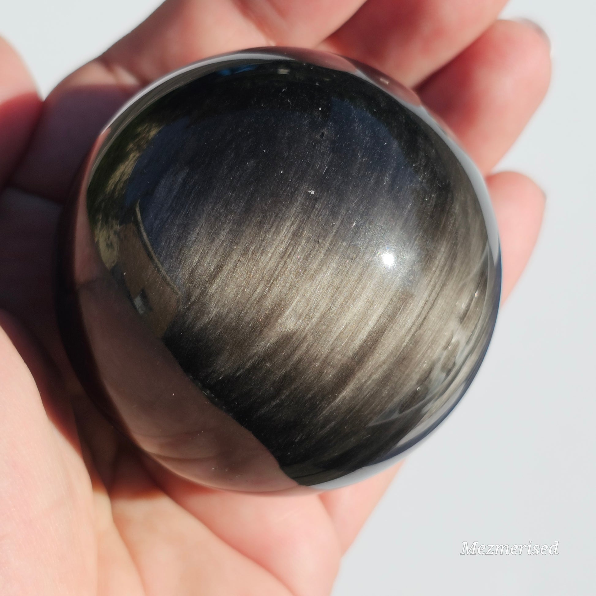 Black Obsidian sphere with an alluring sheen of Silver.