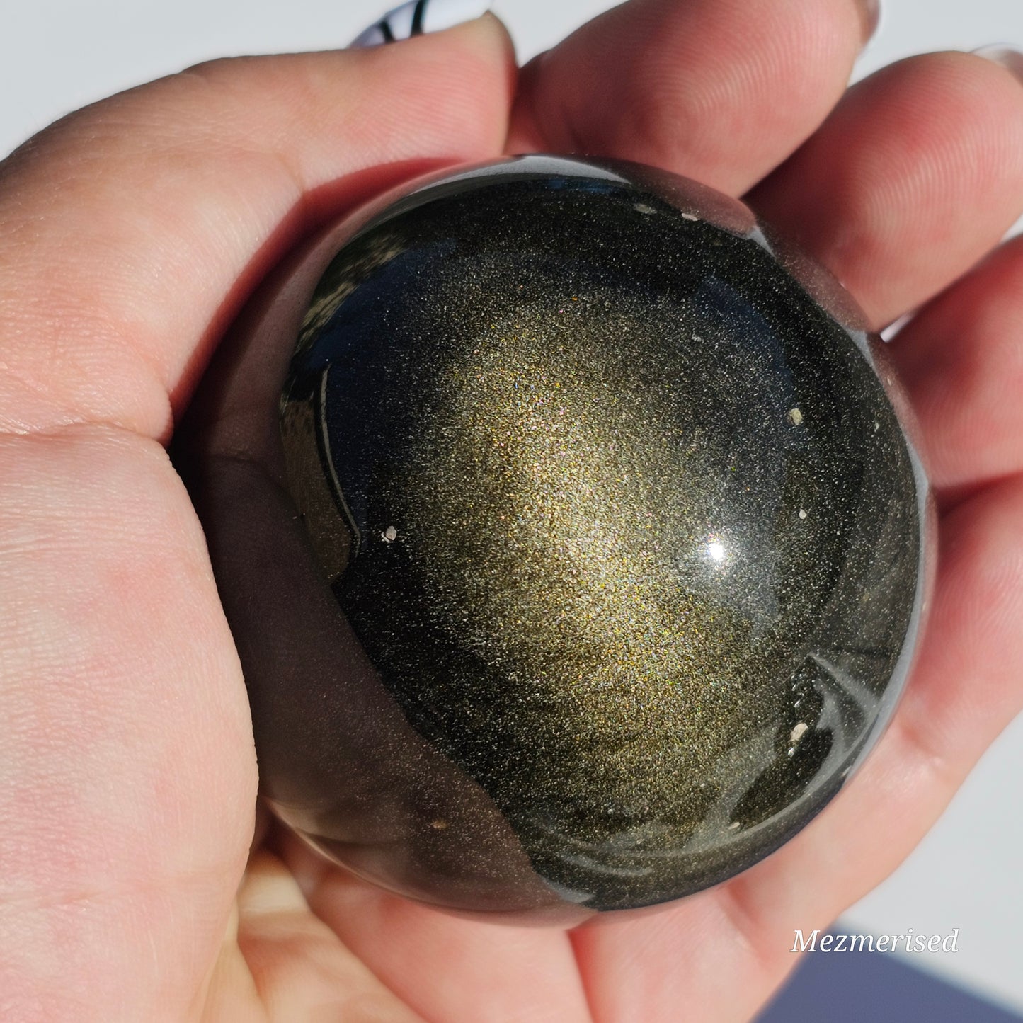 Black Obsidian sphere with an alluring sheen of Gold.