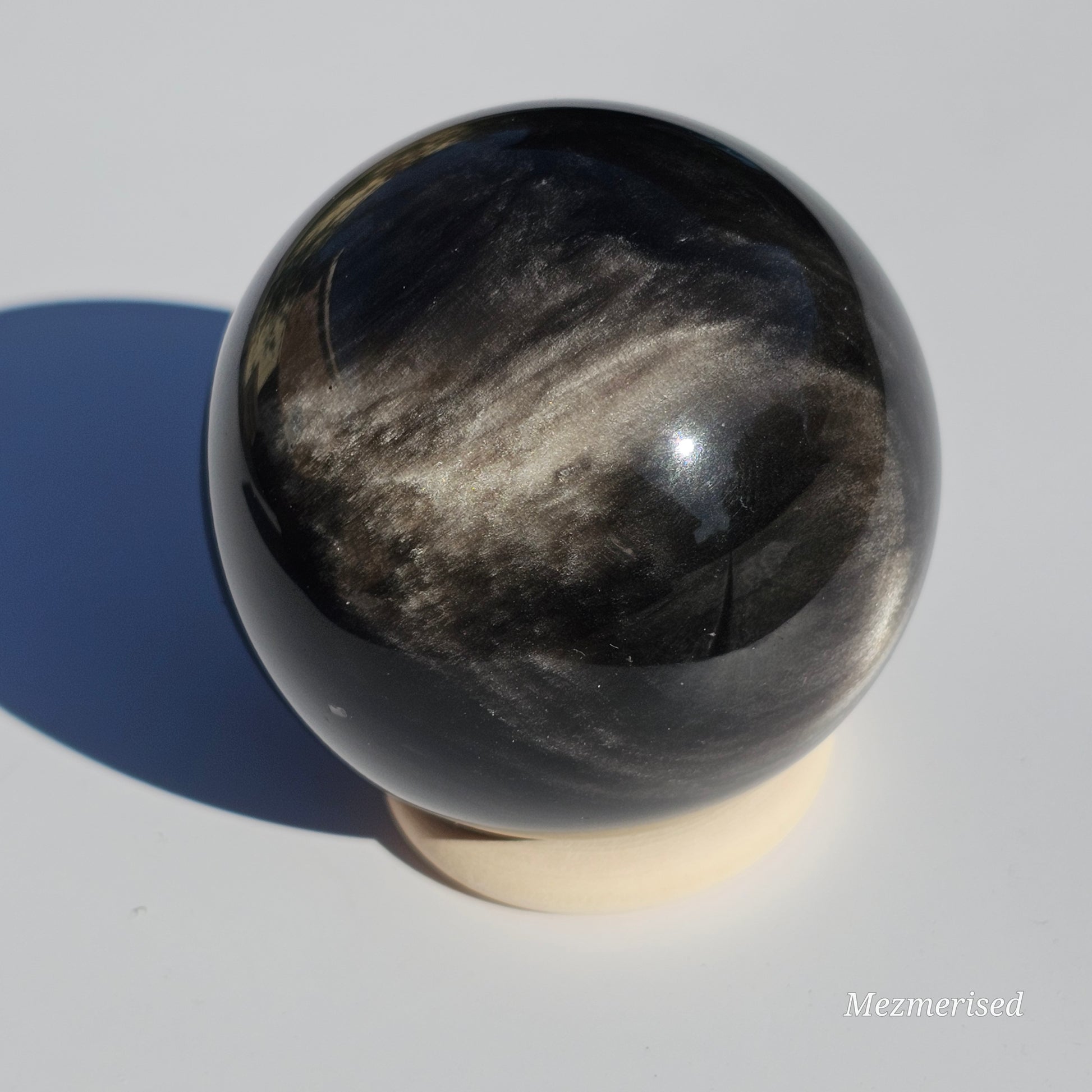 Black Obsidian sphere with an alluring sheen of Silver.