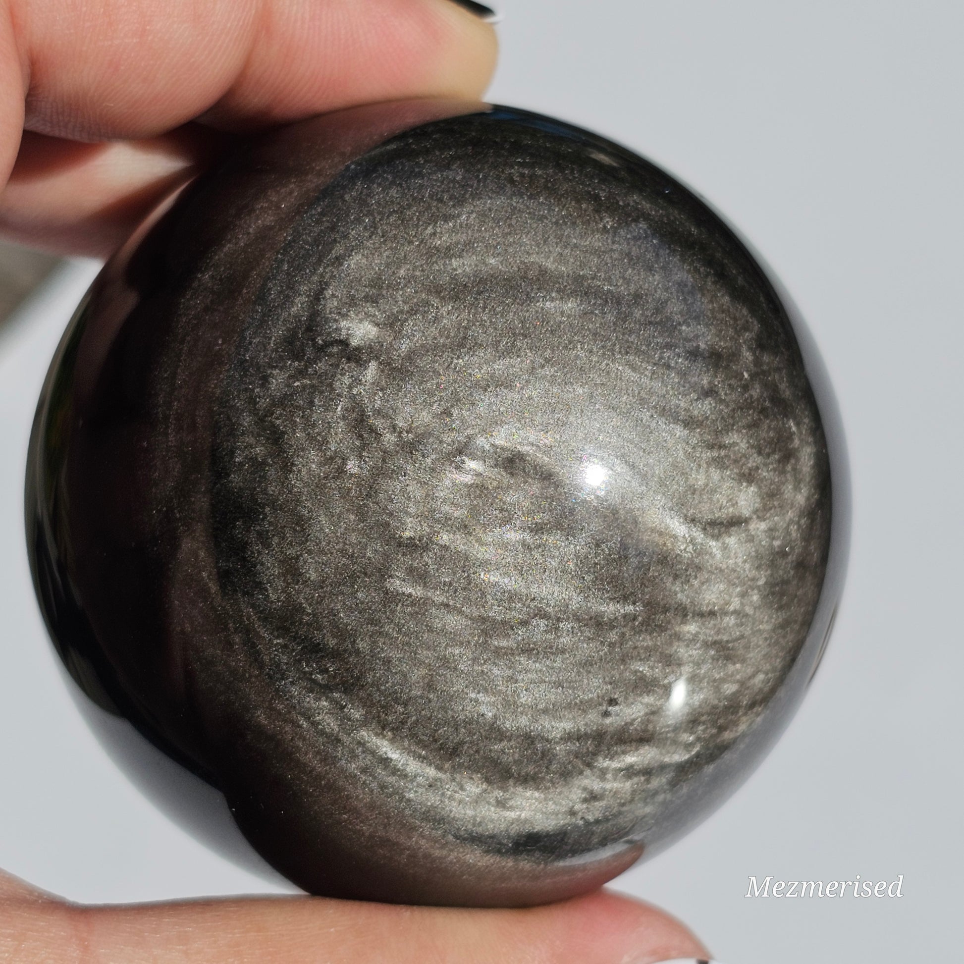 Black Obsidian sphere with an alluring sheen of Silver.