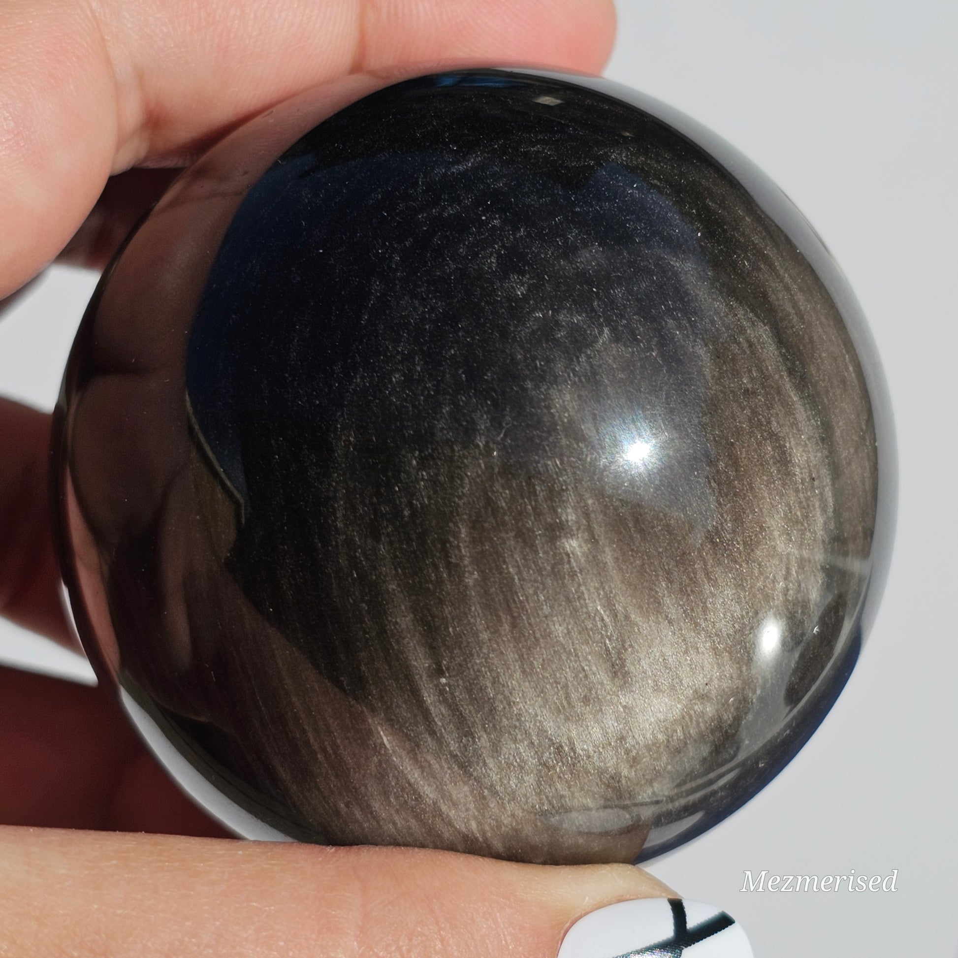 Black Obsidian sphere with an alluring sheen of Silver.