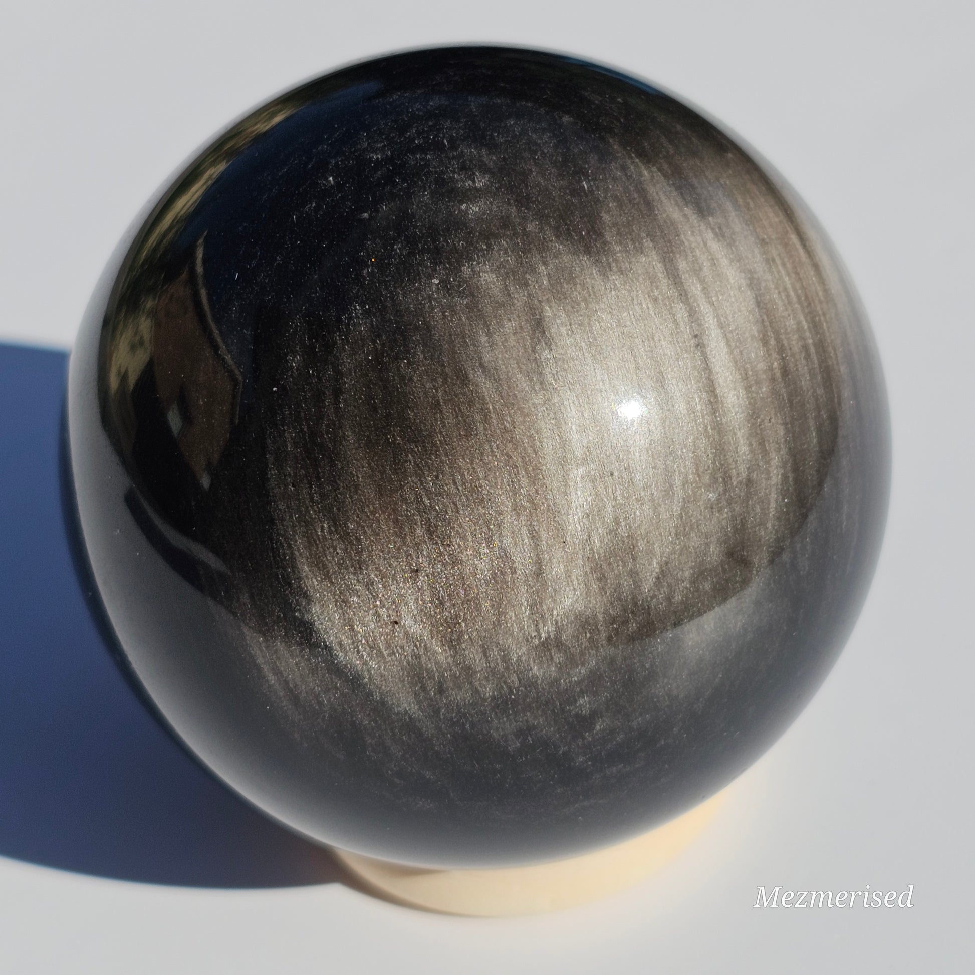 Black Obsidian sphere with an alluring sheen of Silver.