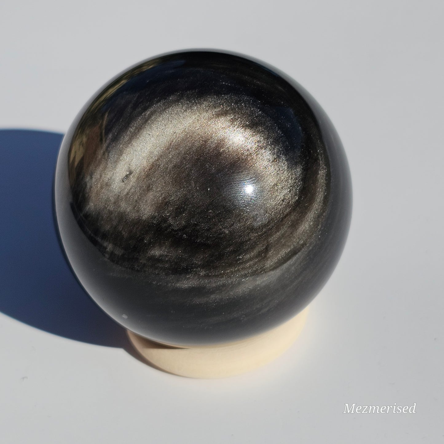 Black Obsidian sphere with an alluring sheen of Silver.